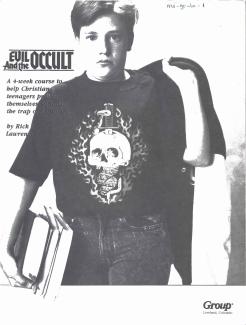 The inner cover with teen wearing "evil" t-shirt with skull, snake and fire motifs